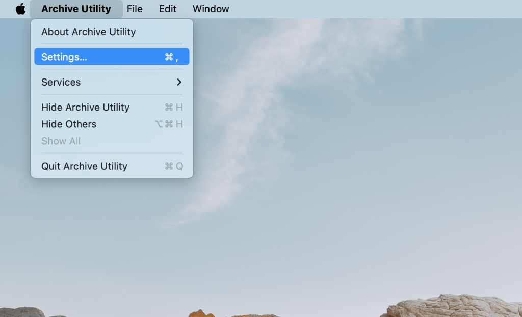 The Archive Utility Mac app is launched and the Settings menu is selected